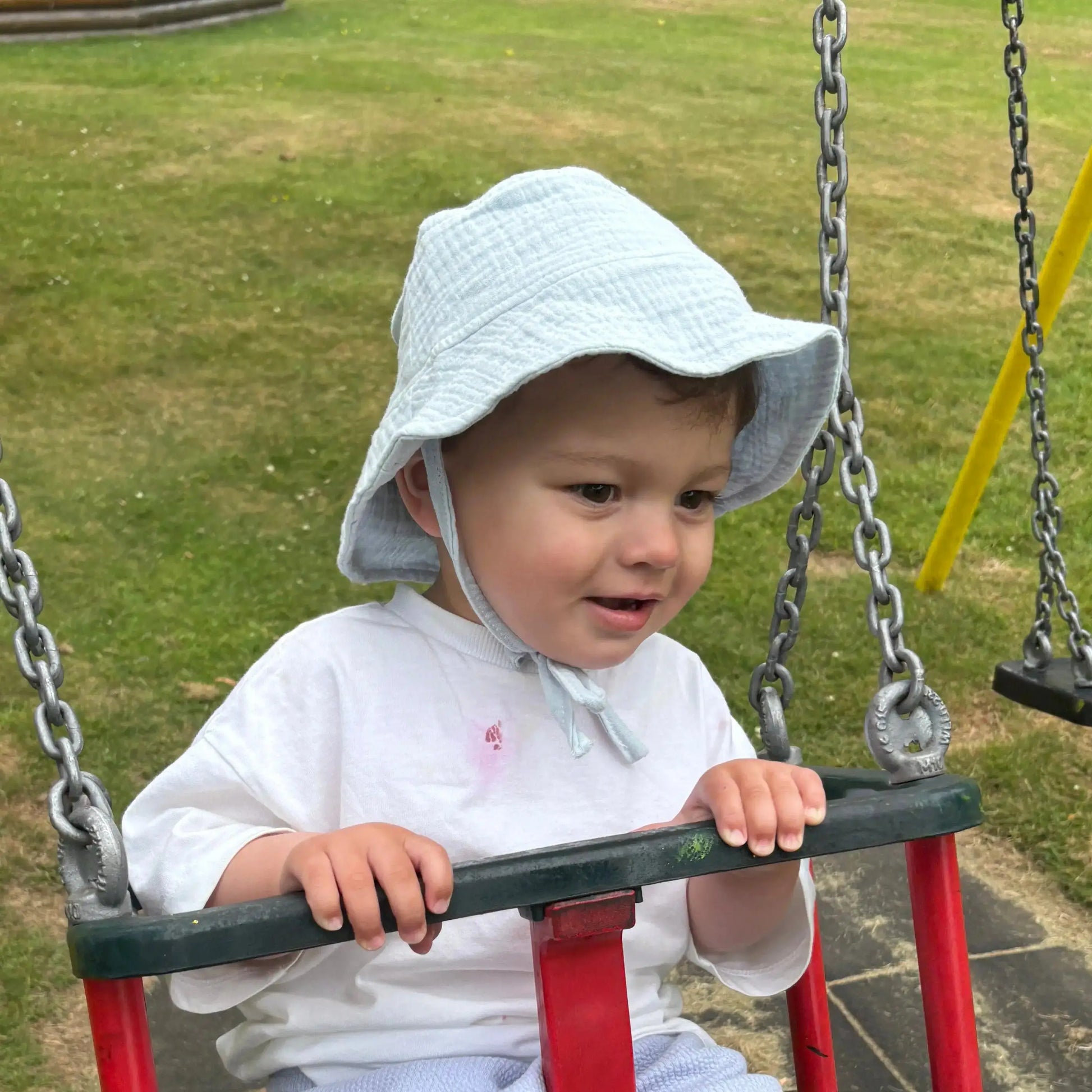 Toddler wearing sun hat