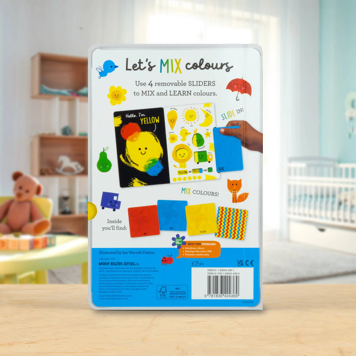 Educational toy packaging for 'Let's Mix Colours' on a wooden surface with a blurred background