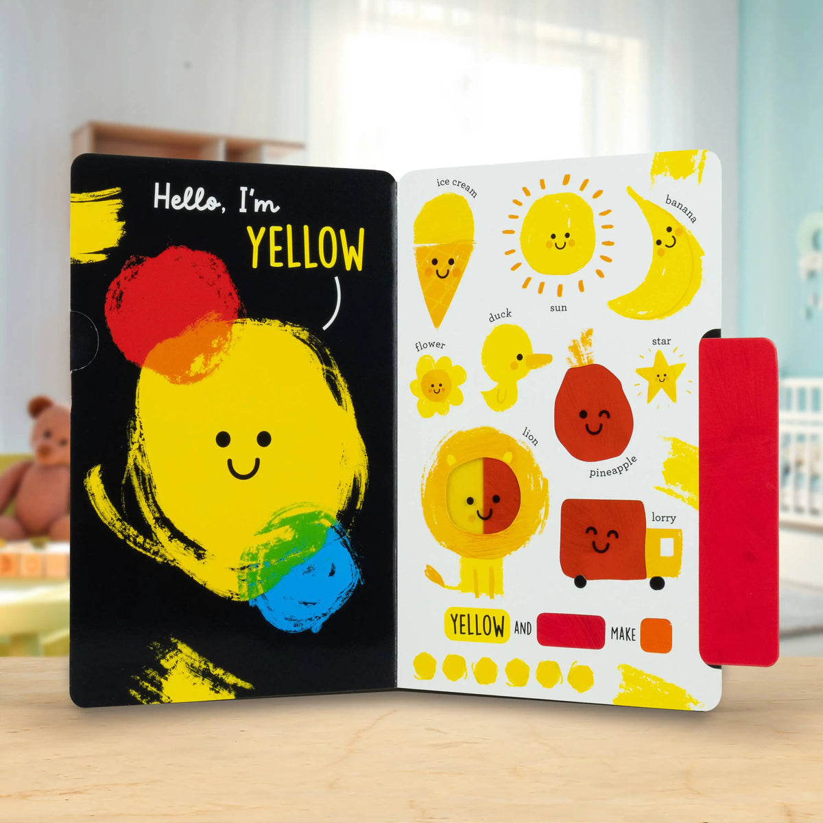 Colourful children's book with a yellow character on a wooden surface