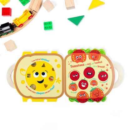 Colourful children's book with a sun character and tomato illustrations on a white background.