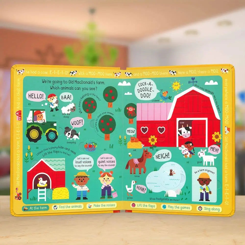Children's educational board book with farm-themed illustrations on a wooden surface.