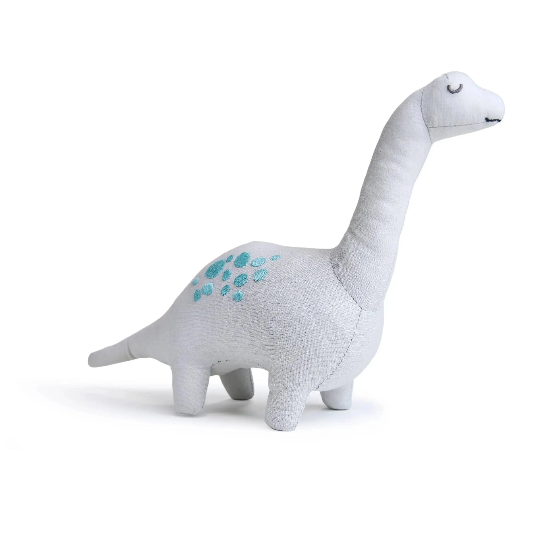 Plush dinosaur toy on a white background