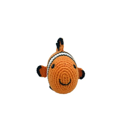 Crocheted fish toy with black fins on a white background
