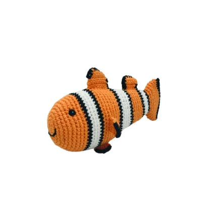 Crocheted clownfish toy on a white background