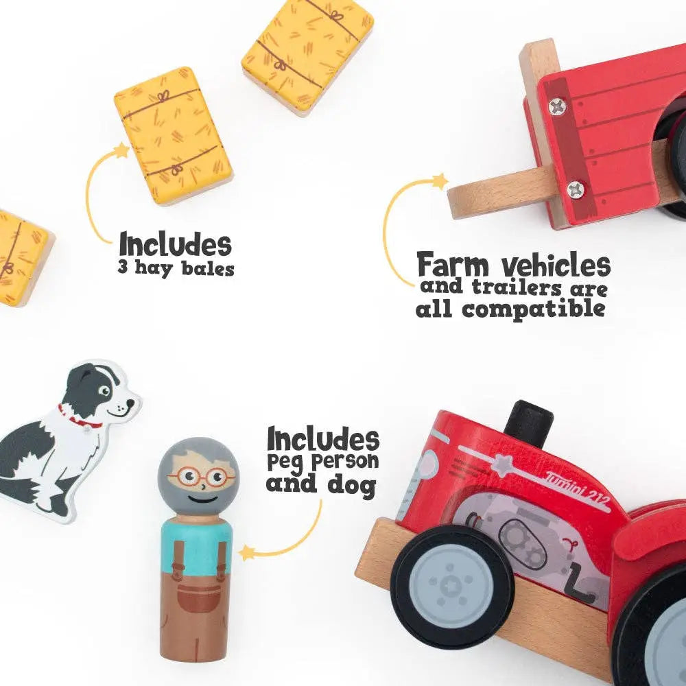 Toy farm set with red tractor, hay bales, and peg person on a white background