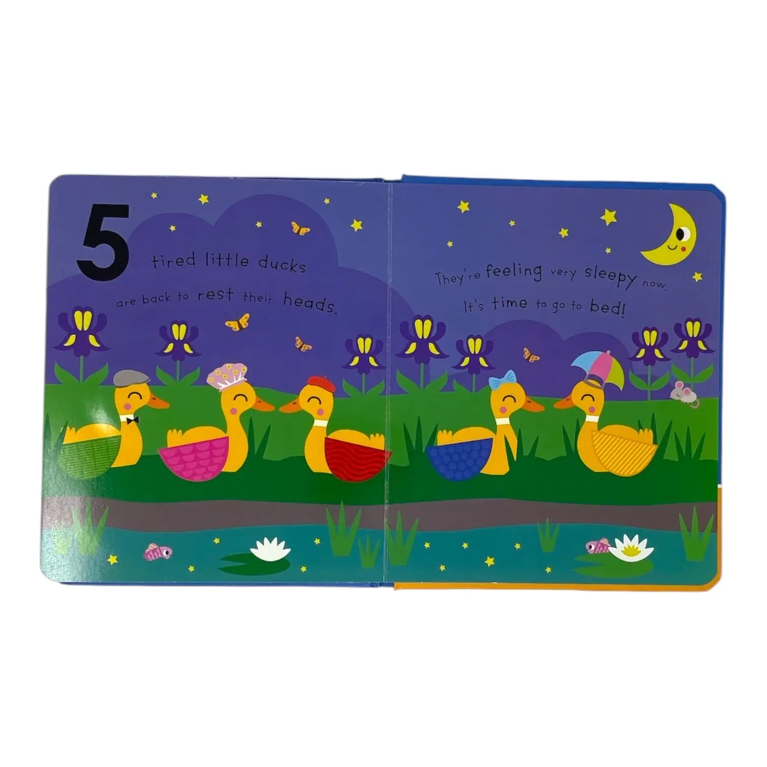 A children's board book shown open on a plain white background, with two illustrated pages featuring five sleepy ducks in a pond under a moon and stars. The left page has the number 5, and the right page has handwritten text about the ducks feeling sleepy and wanting to go to bed.