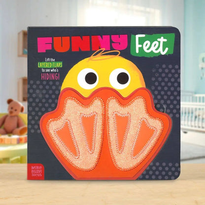 Children's book titled 'Funny Feet' with a cartoon chick design on a wooden surface.