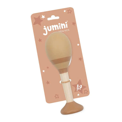 A wooden maraca toy with a beige rubber head and brown base, attached to a tan cardboard hanger card with the brand name 'jumini' and 'Maraca' printed on it.