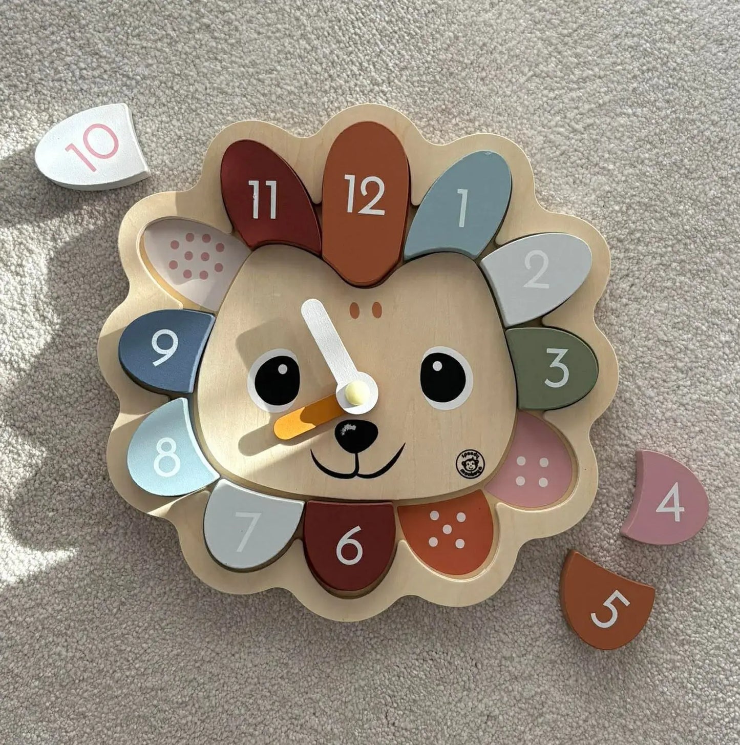 Children's clock with a hedgehog design on a light grey background