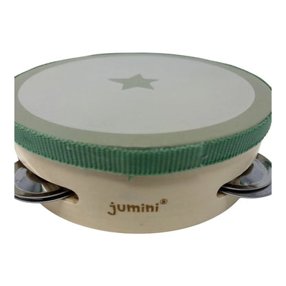 A small wooden tambourine with a light beige body, a green fabric trim around the drum head, and a light beige drum head featuring a star cutout. The brand name 'jumini' is printed on the side.