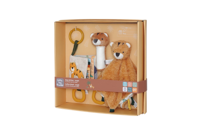 A boxed baby sensory toy set by Little Big Friends, featuring a plush tiger security blanket, a tiger-shaped teething ring, a fabric book, and a yellow ring toy, all arranged inside a tan cardboard gift box with a brown paper band.