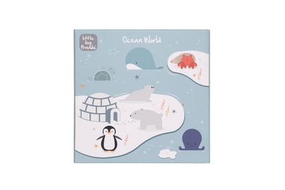 A square children's book or activity booklet titled 'Ocean World' by Little Baby Friends, featuring a light blue cover with whimsical ocean and polar-themed illustrations including a penguin, polar bear, igloo, whale, octopus, and crab on snowy landforms.
