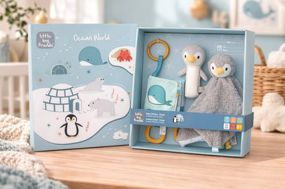Baby gift set with penguin-themed toys and plush in a box labeled 'Little Big Friends Ocean World'.