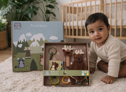 Baby playing with a 'Little Forest World' toy set in a nursery setting
