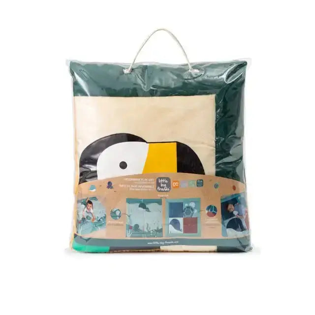 Packaged play mat with a cartoon toucan design on a white background