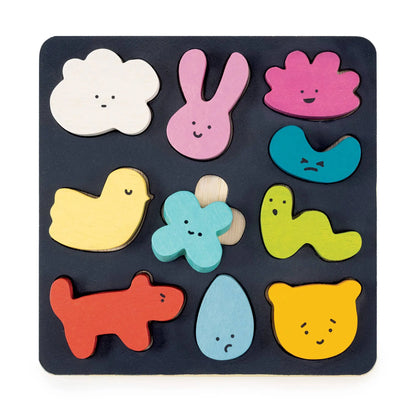 Colourful wooden puzzle with animal shapes on a black base