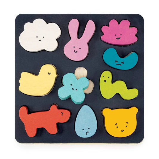 Colourful wooden puzzle with animal shapes on a black base