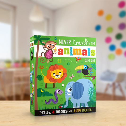 A children's gift set box titled "Never touch the animals" sits on a light wood surface with a softly blurred indoor room in the background. The box features colourful cartoon animals including a monkey, lion, elephant, toucan, and snake on a bright green background.