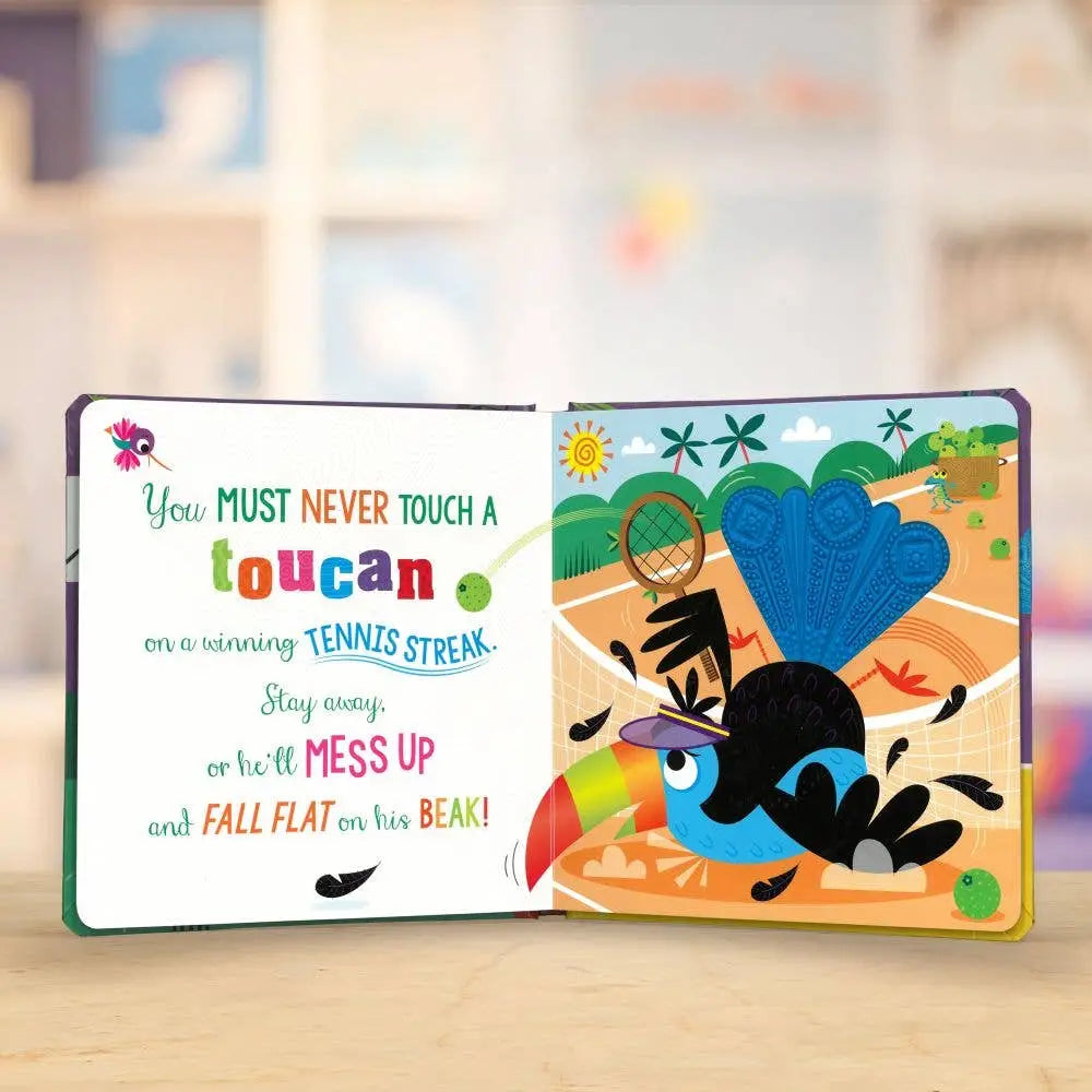 Open book with colourful toucan illustration and humorous text on a blurred background