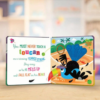 Open book with colourful toucan illustration and humorous text on a blurred background