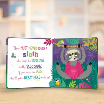 Colourful children's book with a sloth illustration on a wooden surface