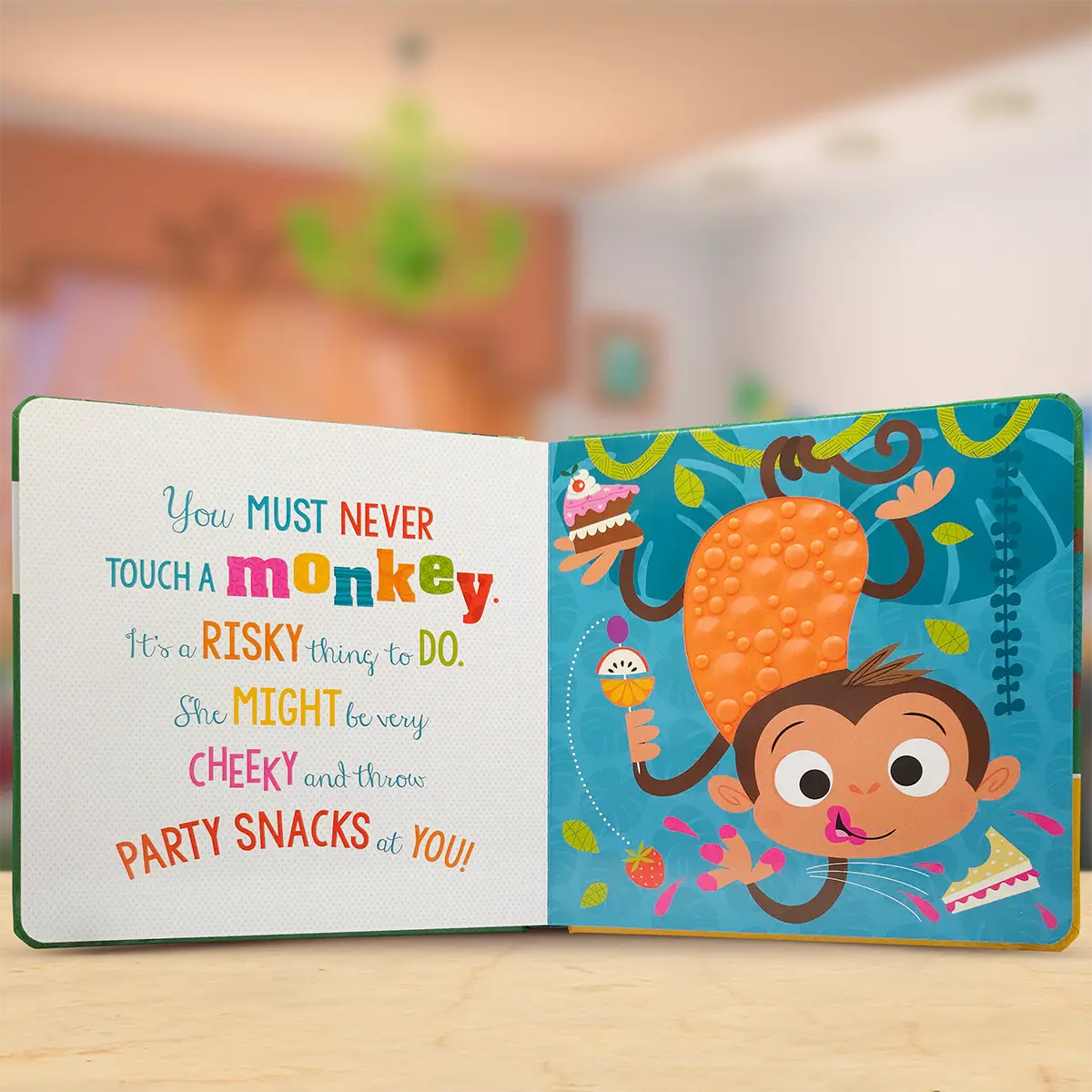 Children's book with a monkey illustration and text on a wooden surface.