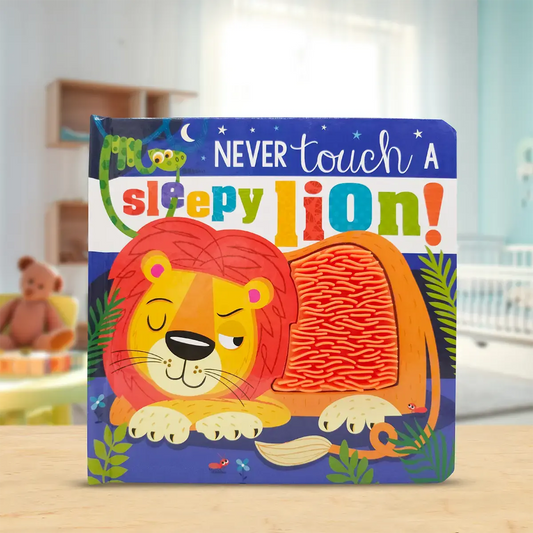 Children's book titled 'Never Touch a Sleepy Lion!' on a wooden surface with a blurred room background.