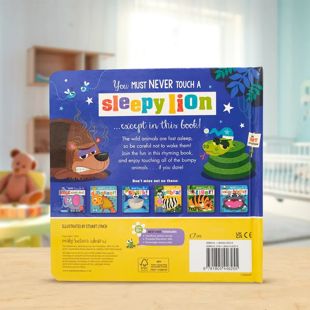 Back cover of a children's book titled 'You Must Never Touch a Sleepy Lion' with illustrations of animals on a wooden surface.