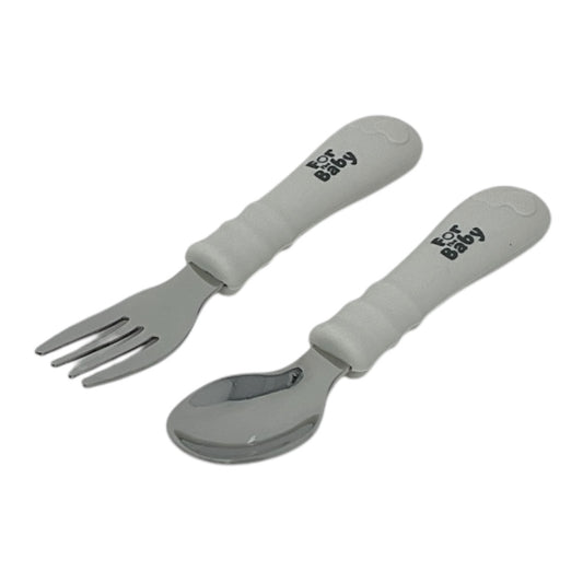 Toddler stainless steel fork and spoon set with soft silicone handles, designed for easy grip and independent eating.