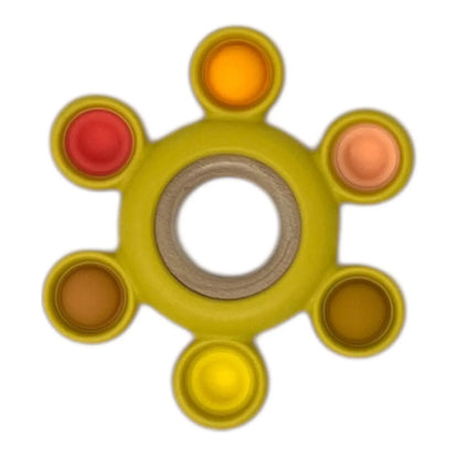 Colourful baby teether with six coloured sections on a white background