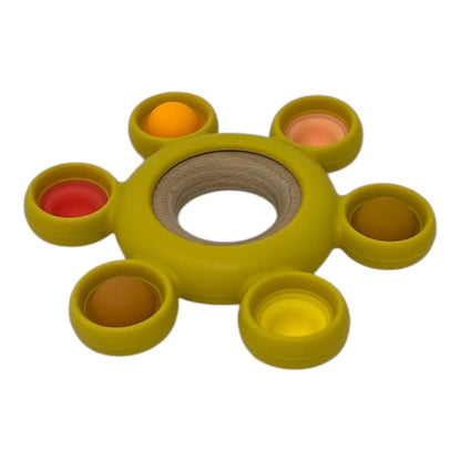 Yellow popper toy with colourful compartments on a white background