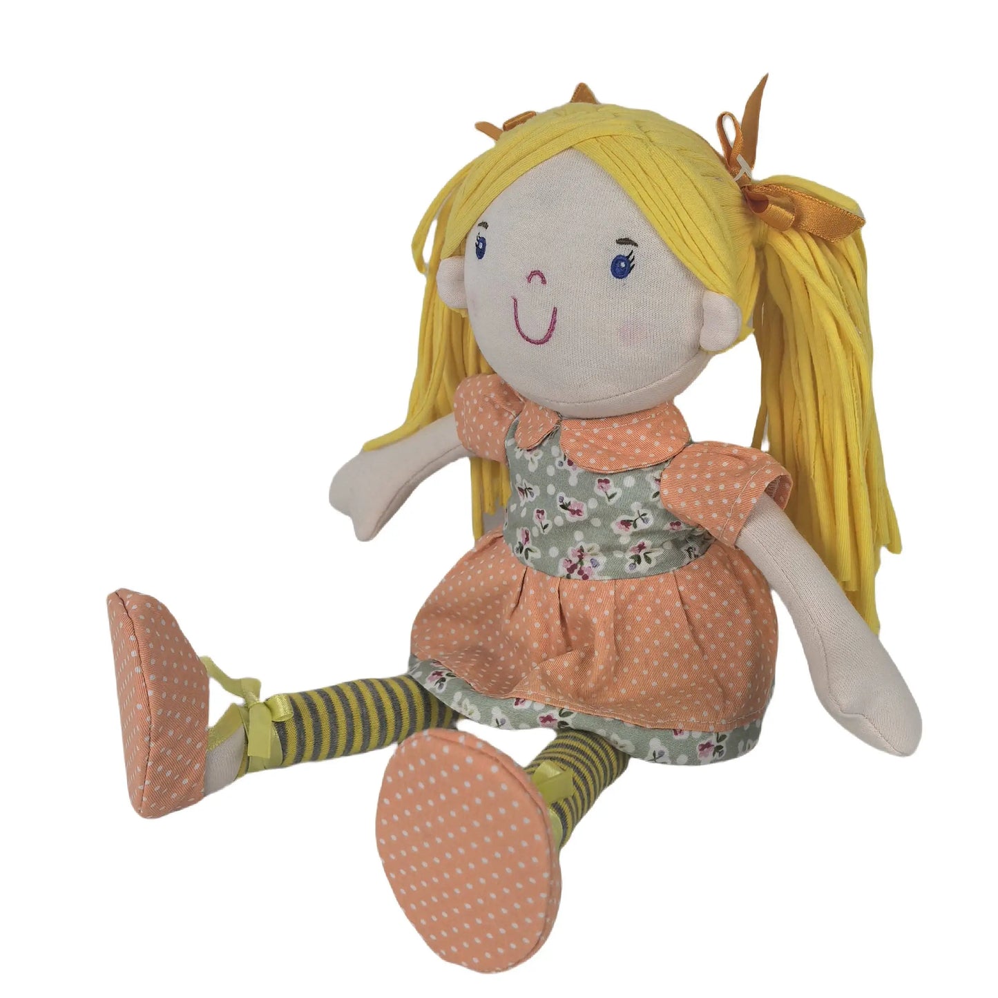 Plush toy doll with blonde hair and a floral dress on a white background