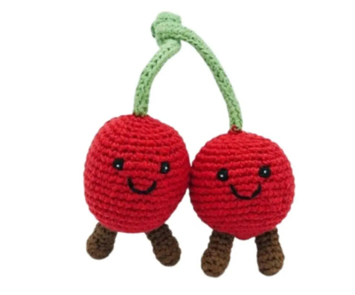 Two red crochet cherries with a green stem on a white background