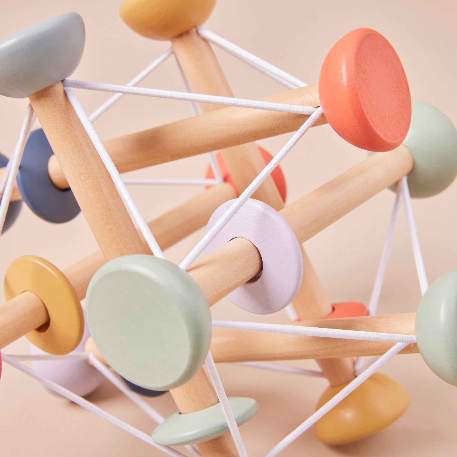 Colourful geometric wooden activity toy with interlocking pieces