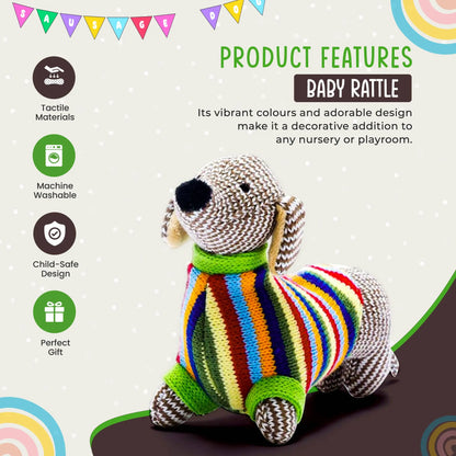 A knitted dog-shaped baby rattle toy with a colourful striped sweater, shown on a light beige promotional background with product feature icons and text.