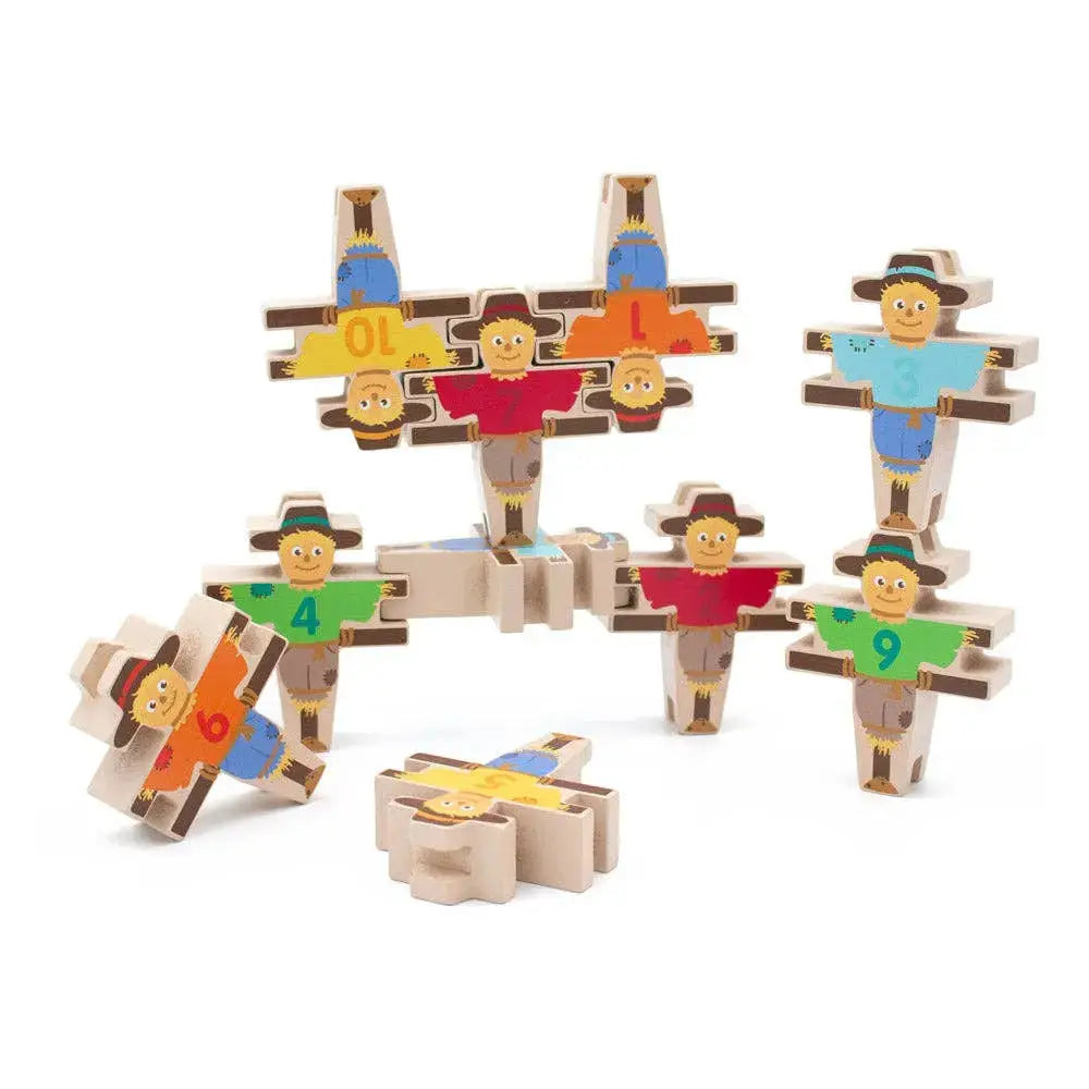 Wooden toy set with colourful figures on a white background