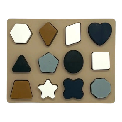 For The Baby silicone shape puzzle with 12 pieces in various colours and shapes including heart, star, and hexagon.