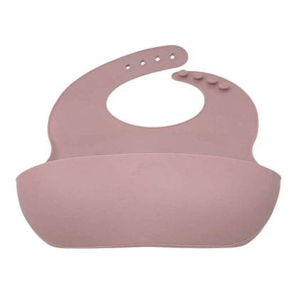 Pink silicone bib on a white background