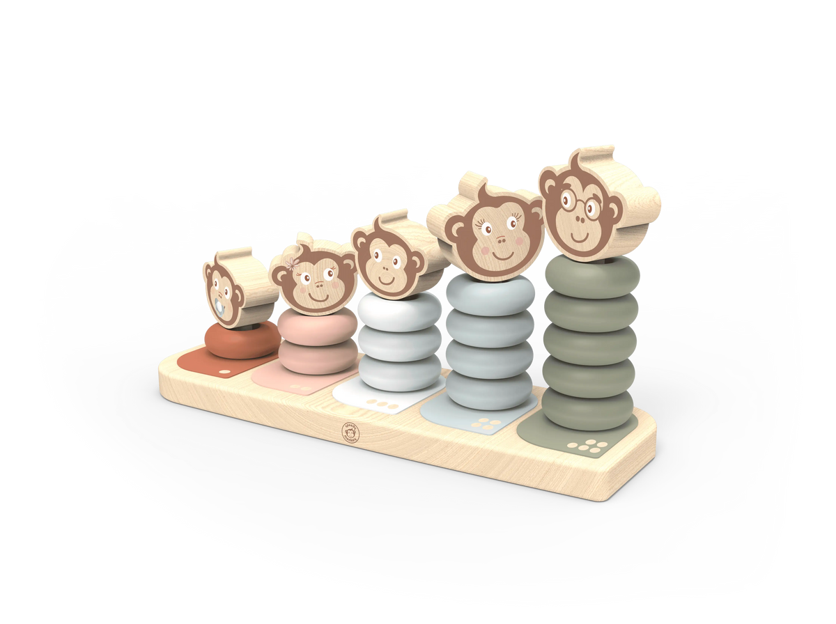 A wooden stacking toy for children featuring five columns of round pegs in terracotta, pink, light blue, grey, and olive green, topped with smiling monkey faces on a natural wood base.