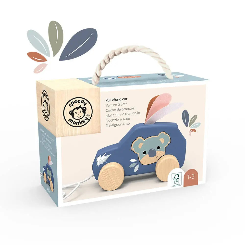 A boxed wooden pull-along car toy by Speech Monkey, shown in its retail packaging on a clean white background. The box features a rope handle, a printed illustration of the blue car with a koala on the front, and multicolour leaf graphics.