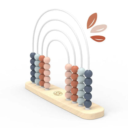 Colourful beaded abacus toy with wooden base on a white background