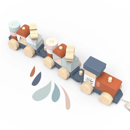 Wooden toy train with colourful cars on a white background