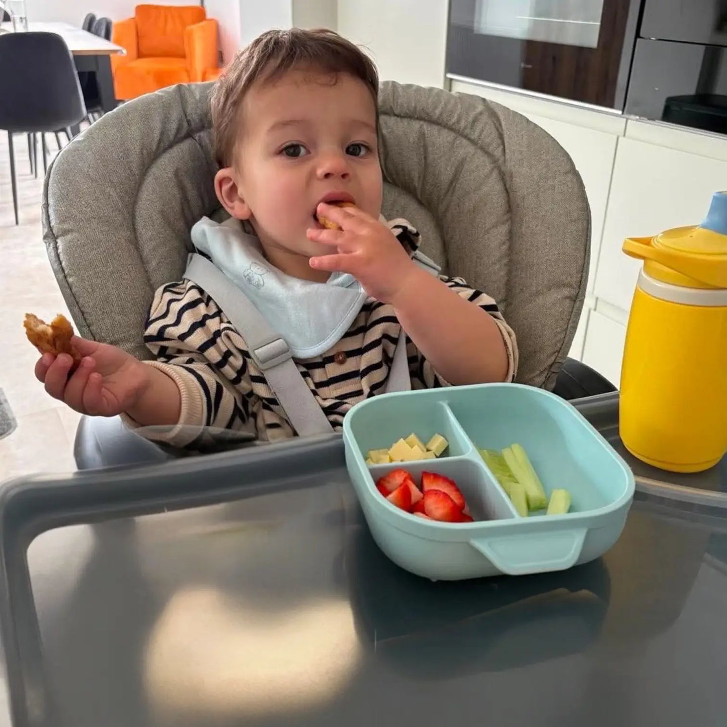 Toddler eating from a square suction plate