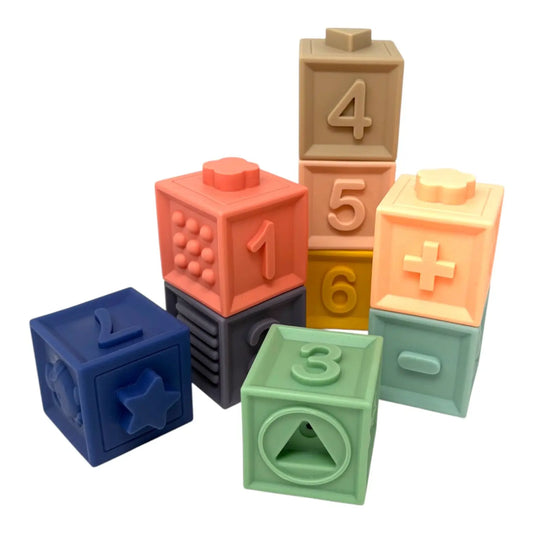 Colourful toy blocks with numbers and shapes on a white background