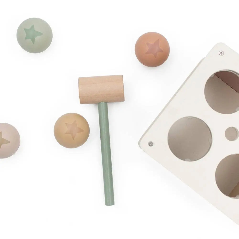 Wooden mallet with star-shaped wooden balls on a white background