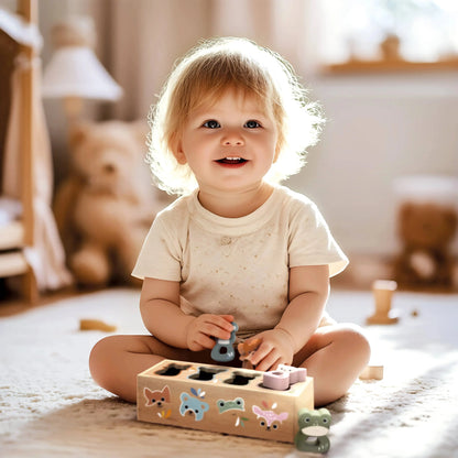 Child playing with a wooden shape sorter toy in a cozy room.