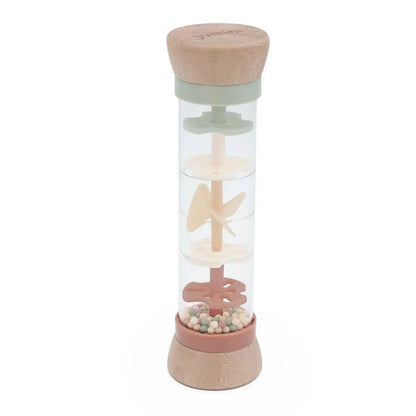 Rain maker toy with wooden and silicone components on a white background