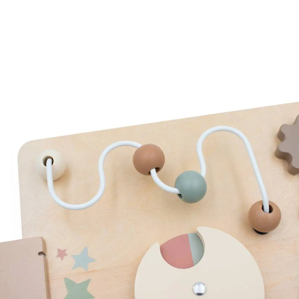 Children's educational toy with beads and shapes on a light beige background