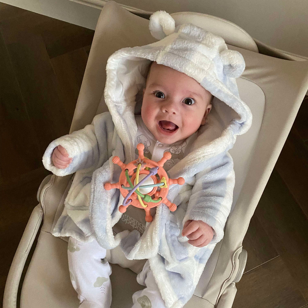 baby happy with rattle