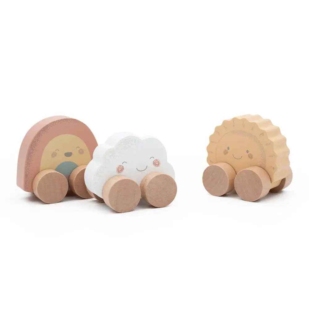 Three wooden toys shaped like a cloud, a rainbow, and a sun on a white background